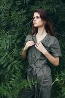Model loneliness adventure concept gray jumpsuit against the background photo