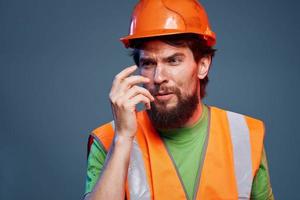 Bearded man in work uniform construction professional cropped view photo