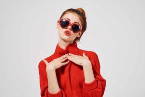 beautiful woman in a red sweater Studio photo