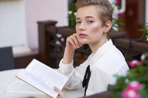 student with a book in his hands outdoors rest fun walking around town Lifestyle photo