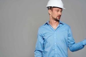 man in blue shirt engineer construction helmet safety work photo