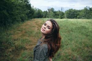 Woman on nature attractive view cropped view landscape green trees photo