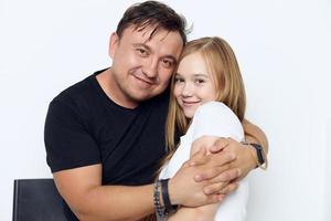 funny father and daughter hugging close-up family photo