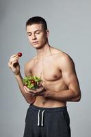 cute guy pumped up torsos plate salad healthy food lifestyle energy photo