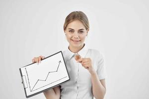 cheerful woman in a white shirt with a folder in hand technologies photo