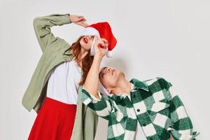 Man and woman Christmas hat Christmas Studio emotions holiday photo