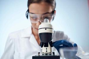 woman laboratory assistant research microscope diagnostics science photo