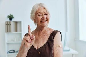 person with a plaster on his arm vaccine passport immunity protection photo