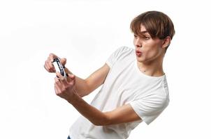 guy in a white t-shirt joystick hands playing entertainment photo