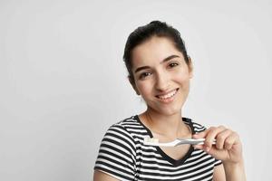 cheerful woman hygiene teeth cleaning care health isolated background photo