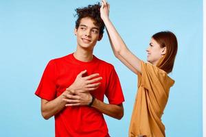 young couple cropped view studio blue background communication photo