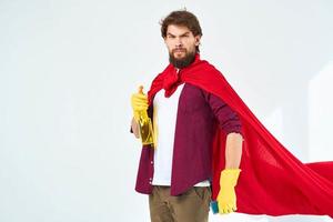 man in red raincoat wearing rubber gloves professional help around the house cleaning photo