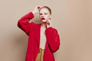 portrait of a woman cosmetics red lips fashion beige background photo