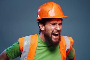 emotional worker orange hard hat construction cropped view photo