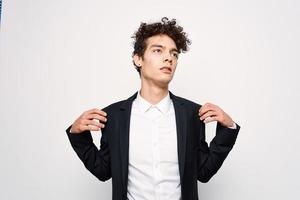 man in black jacket self-confidence curly hair photo