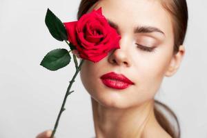 woman with flower eyes closed cute face photo