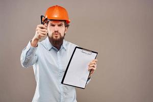 Cheerful male engineer orange hard hat professional construction work photo