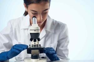 female doctor laboratory microscope diagnostics research microbiology photo