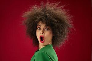 Positive young woman grimace afro hairstyle red lips fashion color background unaltered photo