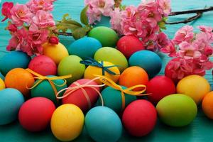 colorful easter eggs top view on blue chalkboard copy space photo
