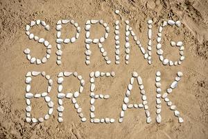 Spring Break - Words Made with Stones on Sand photo