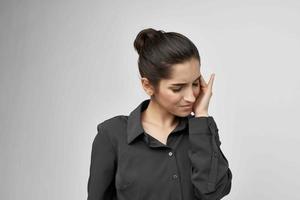 woman holding his head depressed health problems photo