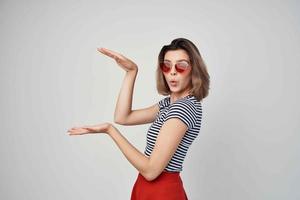 cheerful woman fashion gesture hands emotions light background photo