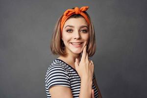 cheerful woman with orange headband cosmetics fashion luxury photo
