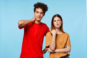 man and woman in multicolored t-shirts communication emotions modern style photo