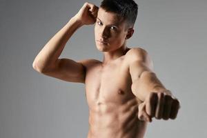 sexy athlete with pumped up torso portrait cropped view fitness photo