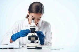 woman laboratory assistant microscope microbiology research photo