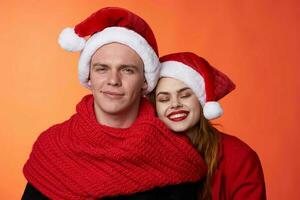 merry couple friendship christmas decoration fun red background photo