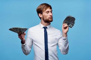 man in shirt with tie finance money self confidence blue background photo