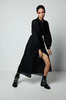 attractive brunette in black dress posing moda studio photo