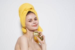 women with yellow towel on head liverwort natural cosmetics skin care cropped view photo