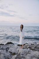 Woman in white dress ocean nature travel freedom photo