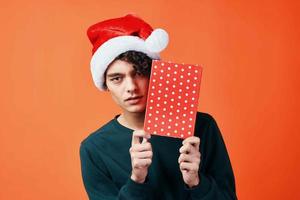 guy in santa hat gift christmas new year holiday photo