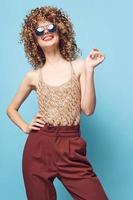 Pretty woman Curly hair smile red lips fashionable clothes bare shoulders photo