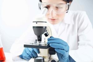 woman laboratory assistant microscope science professional analysis biotechnology photo