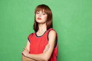 Bright makeup Red shirt Green background and beautiful woman. photo