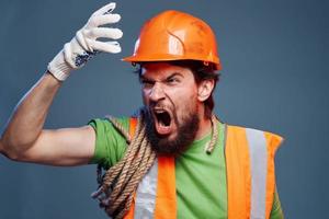 Screaming man cropped view of orange hard hat emotion professional photo