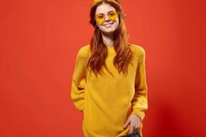 cheerful woman in yellow glasses with a bandage on her head moda Studio emotions photo