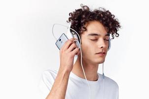 man with curly hair wearing headphones music emotions close-up photo