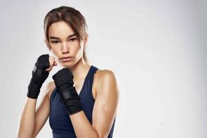 beautiful woman hand bandages punch workout fighter isolated background photo