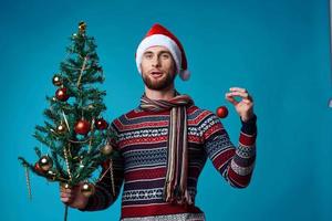 Cheerful man in a christmas white mockup poster blue background photo