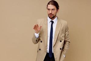 man in beige jacket posing fashion elegant style isolated background photo