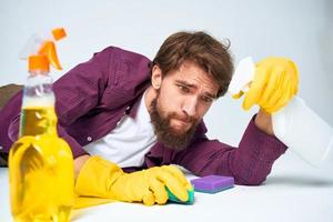 man sitting on floor with bucket homework service room photo