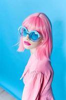 woman in pink wig posing fashion glasses photo