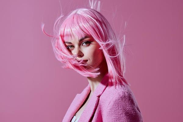 Beauty Fashion woman in a pink blazer pink wig cropped view studio model unaltered