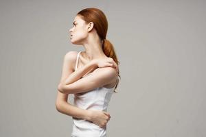 disgruntled woman rheumatism pain in the neck health problems studio treatment photo